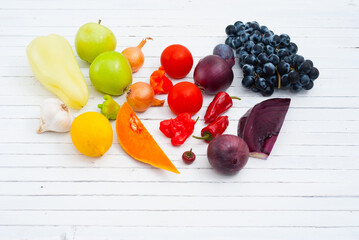 fruits and vegetables on white wood table