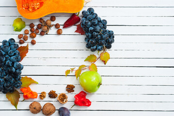 autumn fruits and vegetables on white wooden