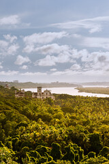 Fototapeta na wymiar Aeriel view of tropical Landcsape in Goa, India with ancient catholic churches in the foreground