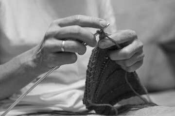 a woman knits clothes