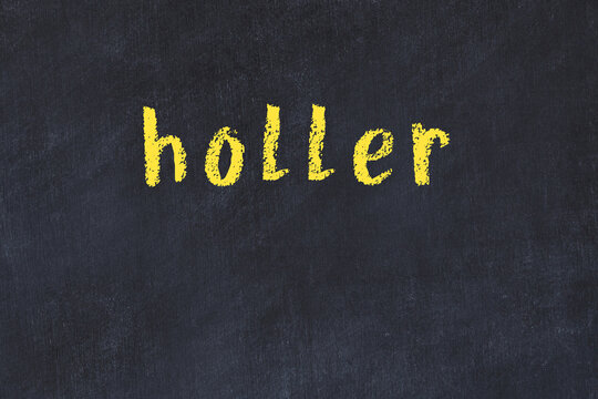 Black chalkboard with inscription holler on in