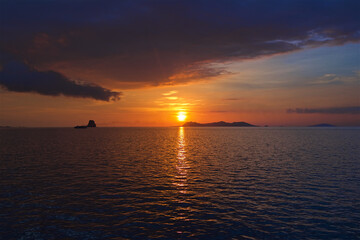 sunset in the Gulf of Thailand, islands near Surat Thani, thunderclouds in the sky, sea landscape, background for wallpaper and walls