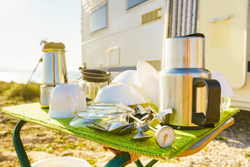 Clean dishes drying on fresh air, capming outdoor