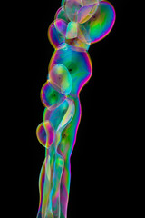 close up of various shapes soap bubble isolated on balck background