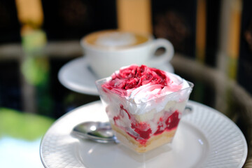 strawberry cream cheesecake in plastic cup