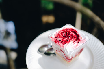 strawberry cream cheesecake in plastic cup