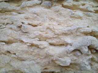 The structure of the sandstone wall close-up, abstraction.