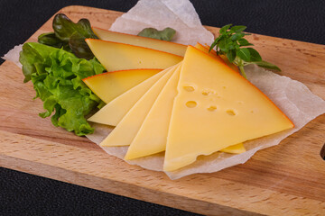 Sliced yellow Swiss cheese