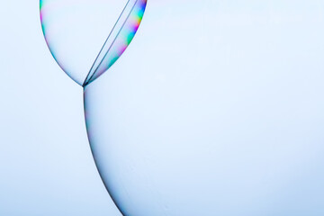 Macro closeup of soap bubbles structure on light blue background
