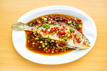 A dish of home-cooked braised croaker on the table