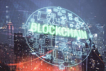 Multi exposure of cryptocurrency theme hologram drawing and city veiw background. Concept of blockchain and bitcoin.