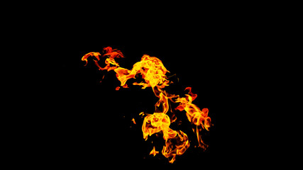 Obraz premium Fire flames on black background isolated. Burning gas or gasoline burns with fire and flames. Flaming burning sparks close-up, fire patterns. Infernal glow of fire in the dark with copy-space