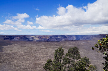 Panoramic view from edge of Kilauea Volcano crater and caldera with lava rock flow field and...