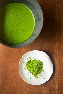 Matcha powder and matcha mixed with water.