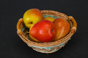 Pear heap in the wooden basket