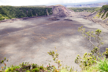 Panoramic view from edge of Kilauea Iki Volcano crater and caldera with lava rock flow field and...