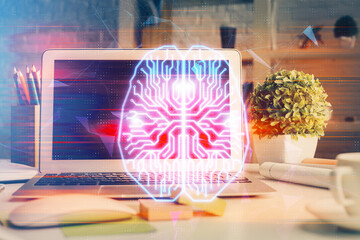 Double exposure of work space with computer and human brain drawing hologram. Brainstorm concept.
