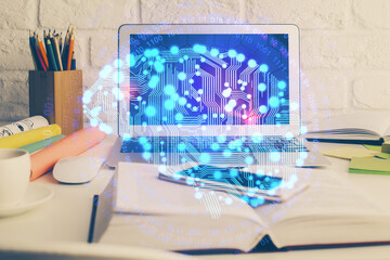Double exposure of work space with computer and human brain drawing hologram. Brainstorm concept.