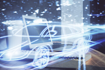 Desktop computer background in office with automobile hologram drawing. Multi exposure. Tech concept.