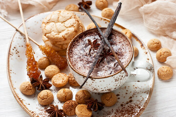 Hot cocoa drink with almond cookies