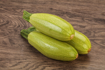 Young tasty zucchini over board