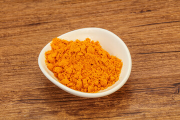 Tumeric powder in the bowl