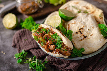 Homemade pita bread with meat and herbs