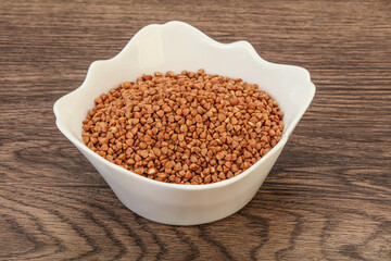 Raw buсkwheat cereal in the bowl