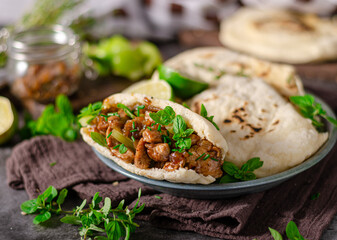 Homemade pita bread with meat and herbs