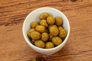 Green pickled olives in the bowl
