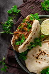 Homemade pita bread with meat and herbs
