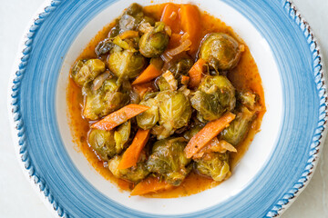 Turkish Style Healthy Organic Vegan Vegetarian Hot Brussel Sprouts Food with Carrots and Tomato Paste.