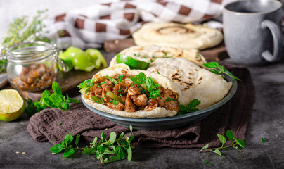 Homemade pita bread with meat and herbs