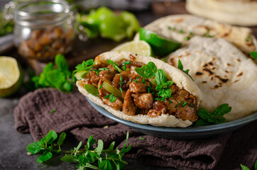 Homemade pita bread with meat and herbs
