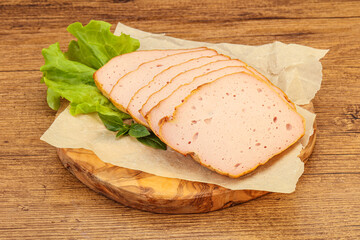 Boiled pork sausage over board