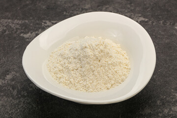 Wheat flour heap in the bowl