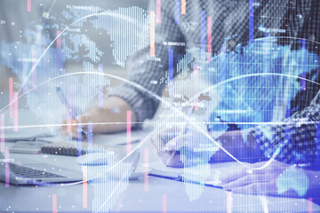 Multi exposure of businessman working on laptop on background. International business hologram in front. Concept of success.