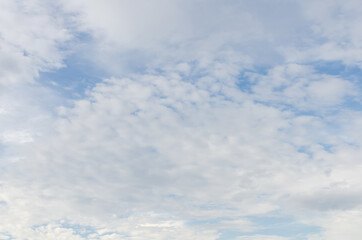 white fluffy clouds in the blue sky, Blue sky background with tiny clouds