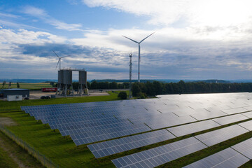 modern infrastructure with solar surfaces and wind turbines
