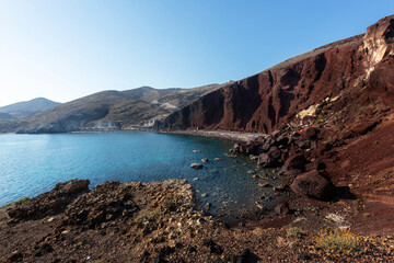 Fototapeta na wymiar Santorini, Red beach, beautiful red bay with a high steep red cliff and beautiful sea and famous beach.