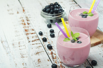 Two glasses with blueberry yogurt