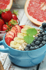 Healthy diet breakfast including cereal with berry and fruits