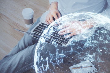 Media network theme hologram with man working on computer on background. Concept of internet...