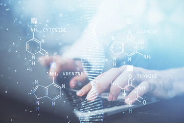 DNA hologram with businessman working on computer on background. Concept of bioengineering. Double exposure.