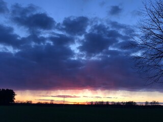 sunset under a dark cloud