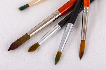 Set of synthetic brushes for painting on white background. Art concept. Drawing process.
