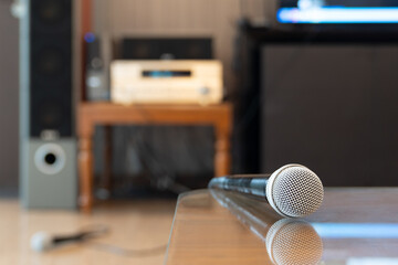 Microphone in karaoke room background.