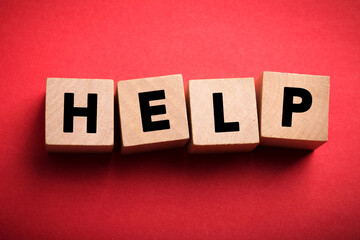 Obraz premium Help Concept Wooden Cube Blocks