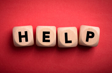 Obraz premium Help Concept Wooden Cube Blocks