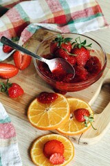 Food art. Tasty composition with strawberry and jam. Sweet summer taste